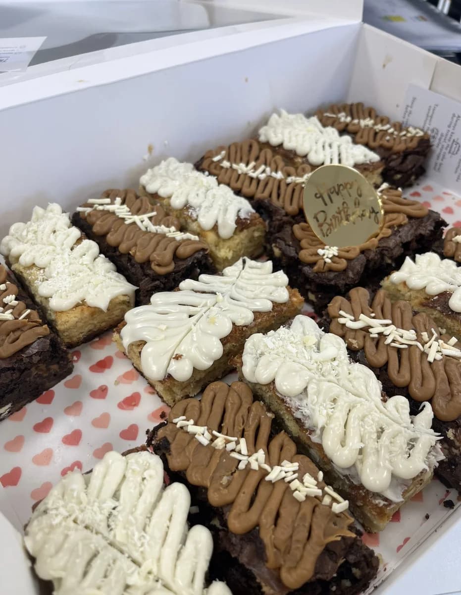 A box of iced brownies and blondies