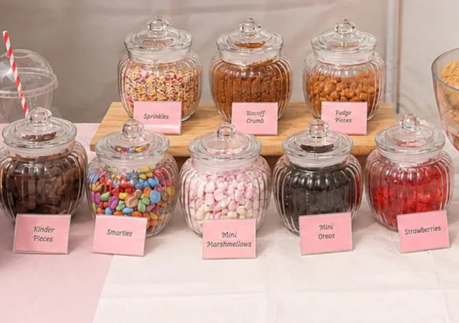 Jars of cookie dough toppings at the stall