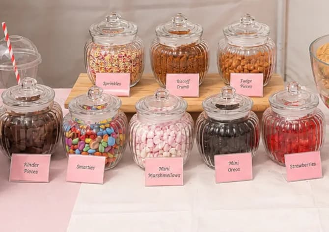 Jars of cookie dough toppings including marshmallows and sprinkles